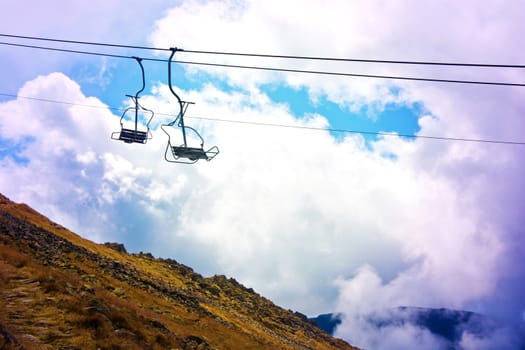 Gondola cable car in mountains. Vacation in mountains.