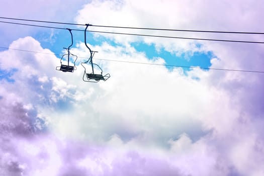 Dream and fantasy conceptual image. Ski lift on the sky.