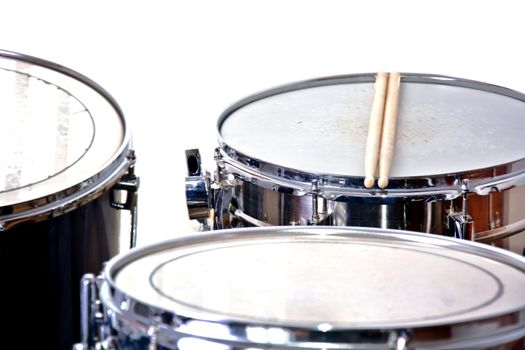 Drums over isolated white background. Music conceptual image. Snare toms and cymbals.