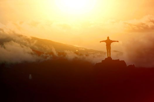 Tourism in mountains. Tourists on the top of the mountain. Nature in mountains at autumn.