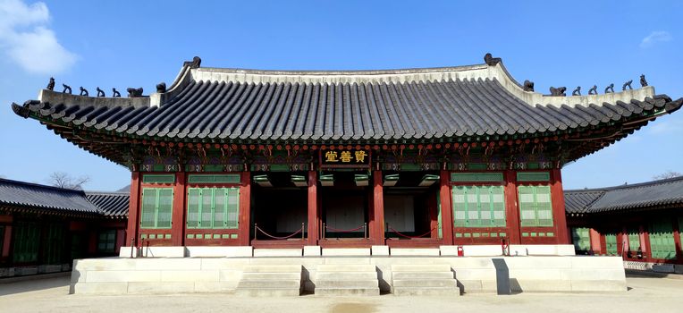Insides of the ancient Gyeongbokgung Palace, Seoul, Korea during day with bright sky