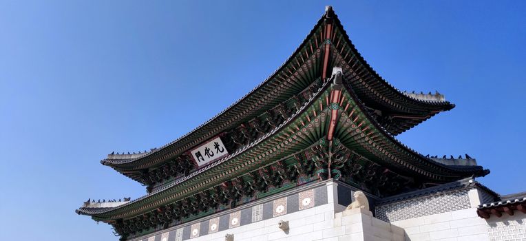 ancient Palace in Seoul, Korea against blue sky in bright day