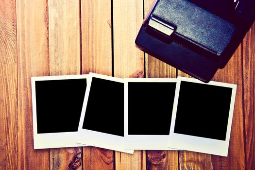 Instant blank polaroid photos frame on wooden background. Free copyspace. Vintage retro.