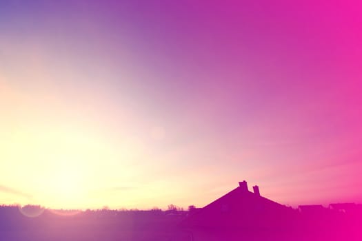Sunrise over house at spring. Abstract instagram vintage picture.