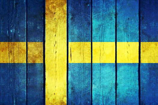 Sweden wooden grunge flag. Sweden flag painted on the old wooden planks. Vintage retro picture from my collection of flags.
