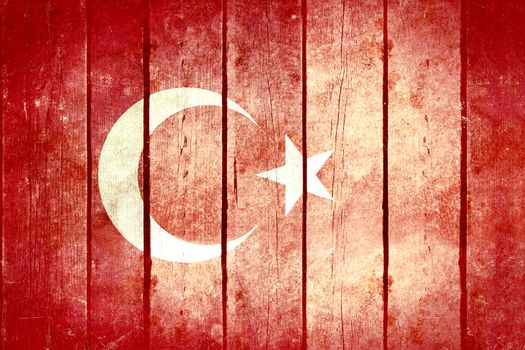 Turkey wooden grunge flag. Turkey flag painted on the old wooden planks. Vintage retro picture from my collection of flags.