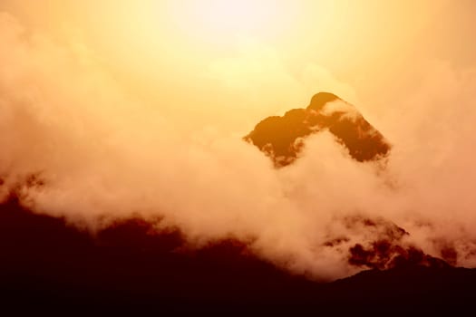 Sunset over mountain peak. Nature in mountains.