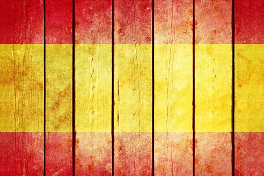 Spain wooden grunge flag. Spain flag painted on the old wooden planks. Vintage retro picture from my collection of flags.