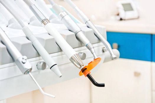 Professional Dentist tools in the dental office. Dental Hygiene and Health conceptual image.