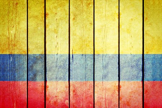 Colombian wooden grunge flag. Colombian flag painted on the old wooden planks. Vintage retro picture from my collection of flags.