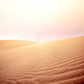 Sand dunes and sky. Hot day in the desert. Nature landscape.