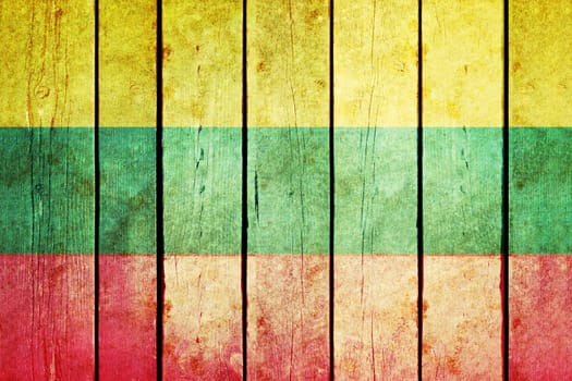 Lithuania wooden grunge flag. Lithuania flag painted on the old wooden planks. Vintage retro picture from my collection of flags.