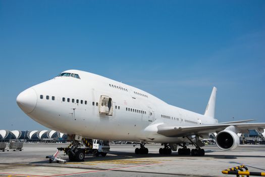 Airplane near the terminal in an airport cockpit