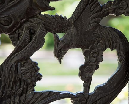 Carved wooden door detail of bird