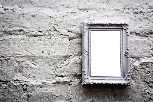 White empty frame with free copy space on white grunge brick wall. Grunge picture.