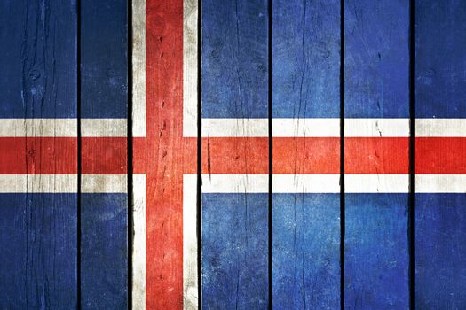 Iceland wooden grunge flag. Iceland flag painted on the old wooden planks. Vintage retro picture from my collection of flags.