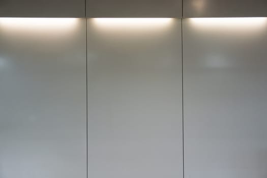 empty white wall with halogen lamps