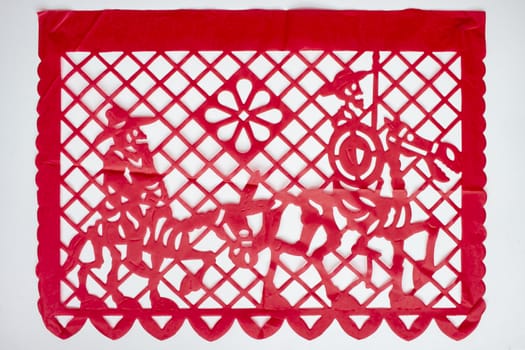 Day of the Dead, Papel Picado. Red Real traditional Mexican paper cutting flag. Isolated on white background.
