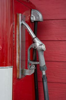 the Gas pump nozzles in the retro service station, vintage color tone