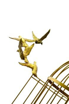 gold Sculpture of a Dove Being Set Free