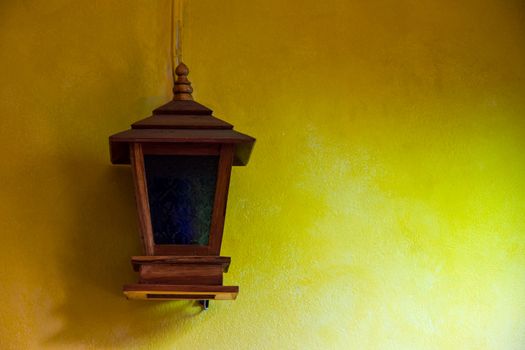 Lantern on a yellow wall vintage design