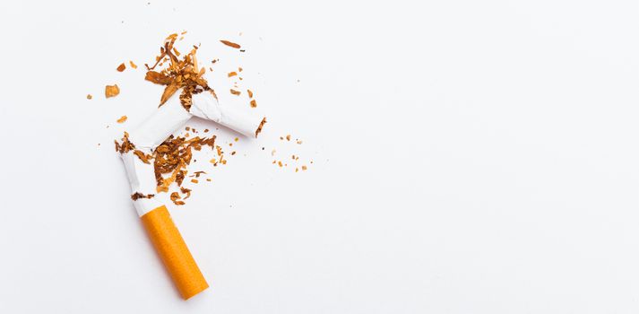 31 May of World No Tobacco Day, no smoking, close up of broken pile cigarette or tobacco STOP symbolic on white background with banner copy space, and Warning lung health concept