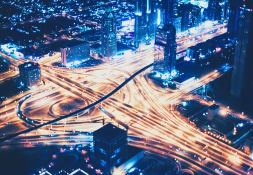 Aerial night view of Dubai in United Arab Emirates, metropolitan cityscape scenery