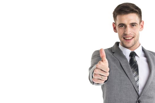 Smiling young businessman with thumb up isolated on white background