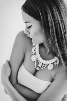 girl in a white blouse and black skirt on a white background