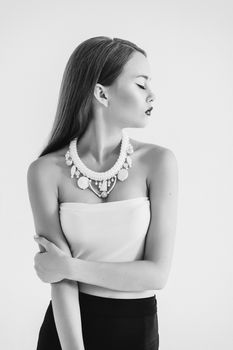 girl in a white blouse and black skirt on a white background