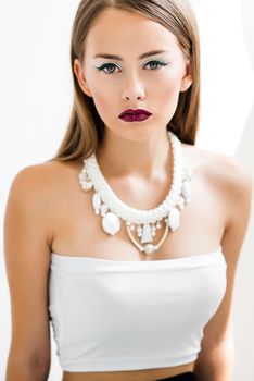 girl in a white blouse and black skirt on a white background