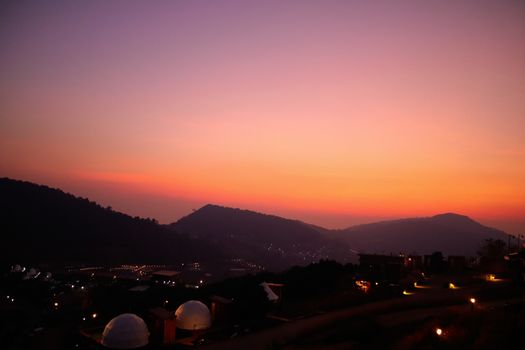 The sunset in a thai village near mountains in Chiang Mai, Thailand. The mountain scenery view