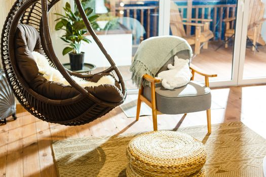 A chair sitting in front of a wooden table. High quality photo