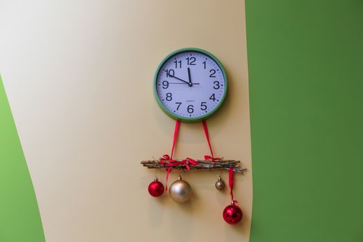 A clock hanging on the wall. High quality photo