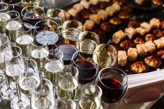 A dining table filled with wine glasses. High quality photo