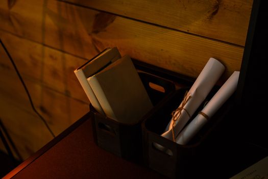 A laptop computer sitting on top of a wooden table. High quality photo