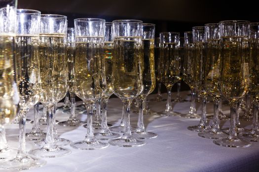 A row of wine glasses on a table. High quality photo