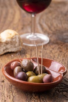 mixed olives on dark wood