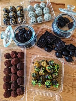 Selection of handmade chocolates. Chocolate is one of the most popular holiday gifts. On Valentine's Day, a box of chocolates is traditional, usually presented with flowers and greeting card.