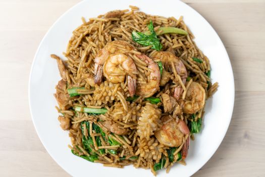 Top view of pan fried noodles with seafood, Foochow Chinese style