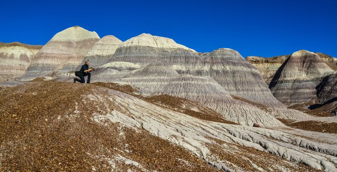 USA, ARIZONA- NOVEMBER 18, 2019: The Painted Desert on a sunny day. Diverse sedimentary rocks and clay washed out by water. Petrified Forest National Park, USA,  Arizona  