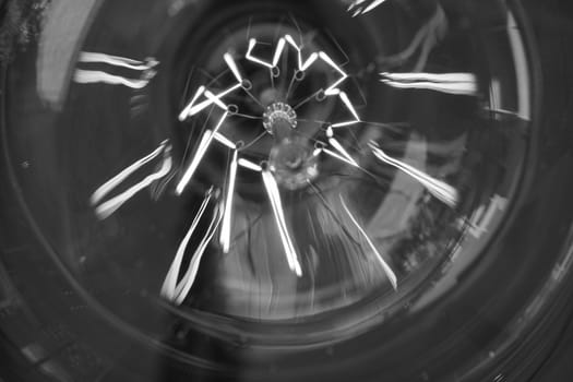 Amazing spiral electric current inside a retro crystal clear light bulb.