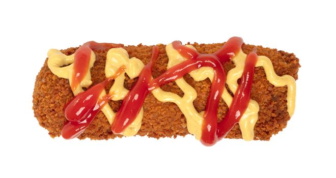 Brown crusty dutch kroket with mustard and ketchup topping isolated on a white background