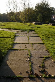 Path through a cemetery made of tombstones, Manchester, UK