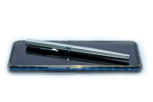 The luxury pen on a smart phone on white Background.