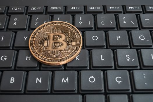 close up cryptocurrency coins on keyboard background