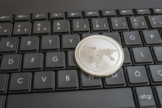 close up cryptocurrency coins on keyboard background