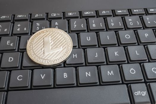 close up cryptocurrency coins on keyboard background