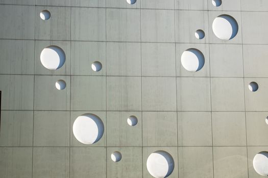 Background texture. A wall with round holes in the form of gas bubbles.