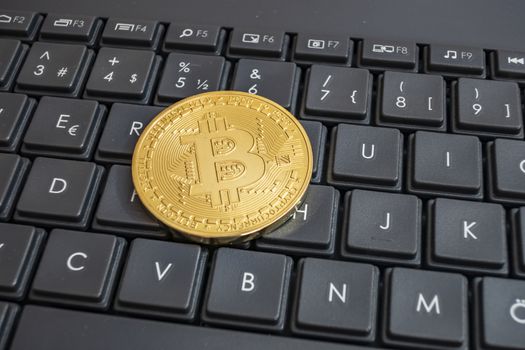 close up cryptocurrency coins on keyboard background